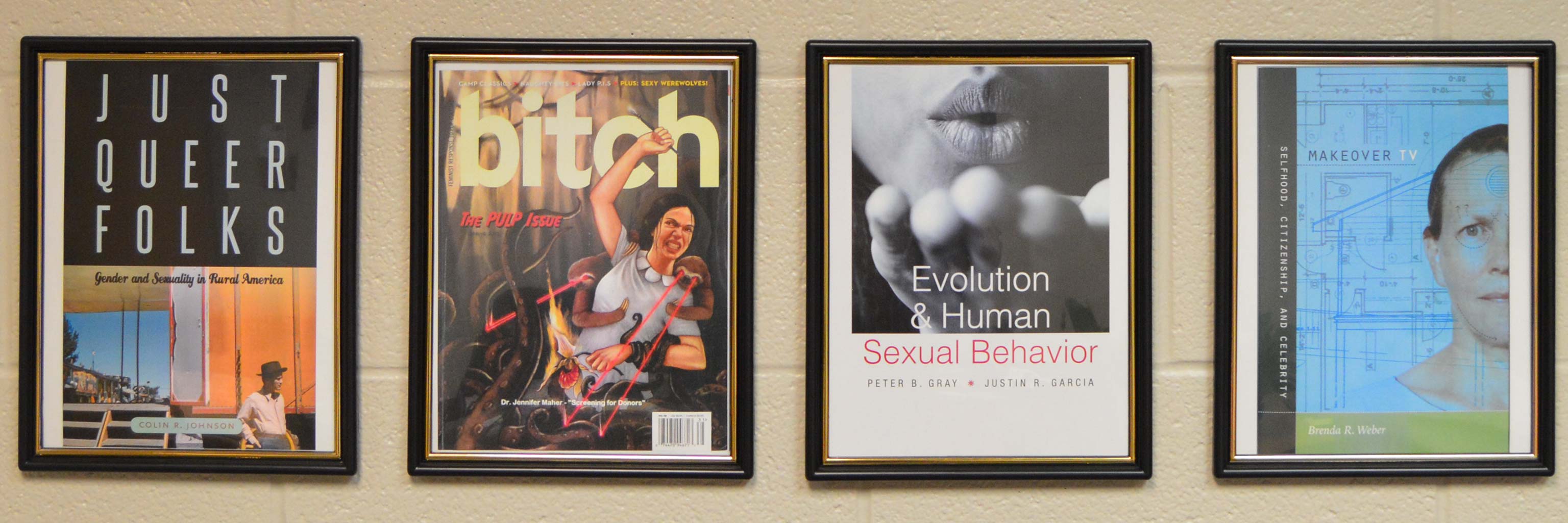 framed publications hanging on a wall