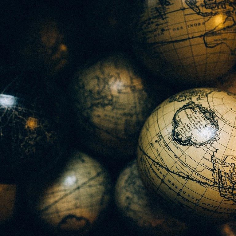 pile of globes in a dark room